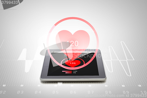 Image of close up of tablet pc computer with heart rate