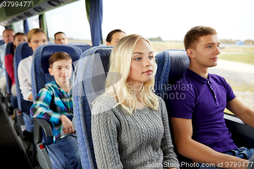 Image of happy couple or passengers in travel bus