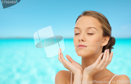Image of young woman face and hands
