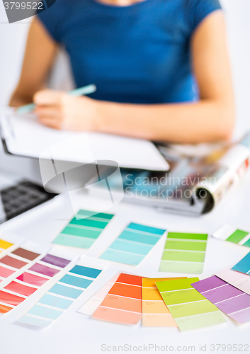 Image of woman working with color samples for selection