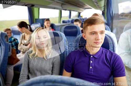 Image of couple or passengers in travel bus