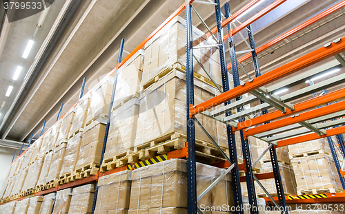 Image of cargo boxes storing at warehouse shelves