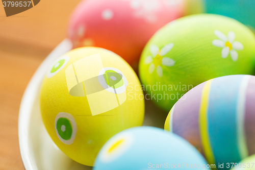 Image of close up of colored easter eggs on plate