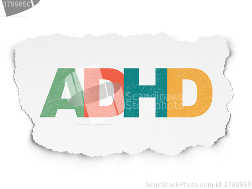 Image of Medicine concept: ADHD on Torn Paper background