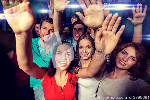 Image of smiling women dancing in club