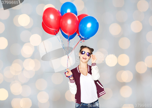 Image of happy teenage girl with helium balloons