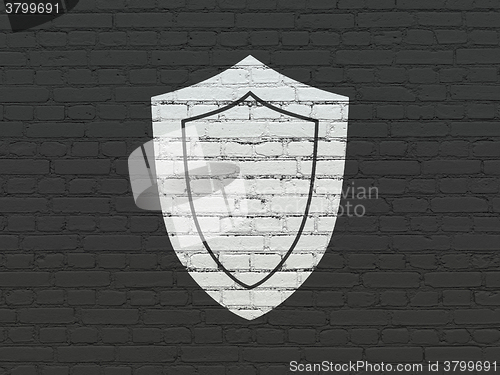 Image of Security concept: Shield on wall background