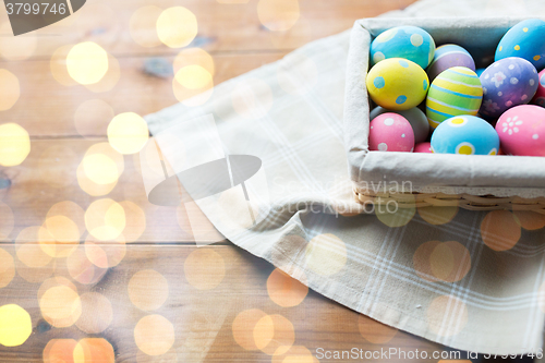 Image of close up of colored easter eggs in basket