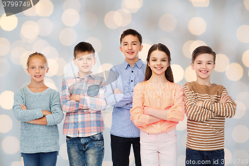 Image of happy smiling children over holidays lights