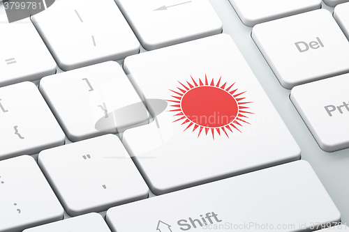 Image of Tourism concept: Sun on computer keyboard background