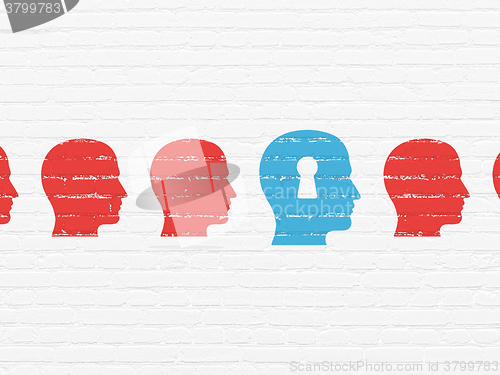 Image of Education concept: head with keyhole icon on wall background