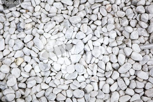 Image of White stones at a grave as a background