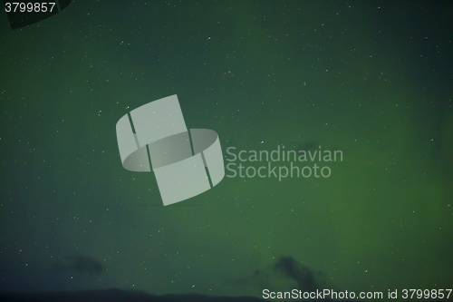 Image of Northern lights with bright stars in Iceland