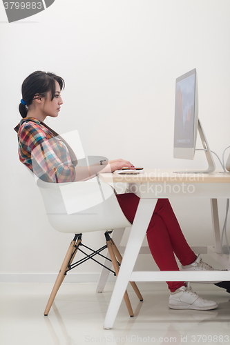 Image of startup business, woman  working on desktop computer