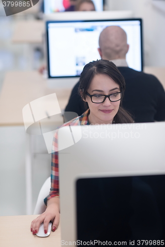 Image of startup business, woman  working on desktop computer