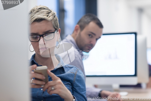 Image of startup business, woman  working on desktop computer