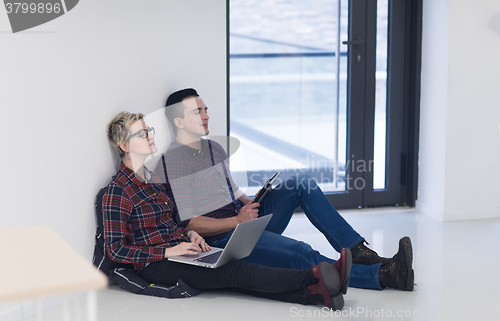 Image of startup business, couple working on laptop computer at office