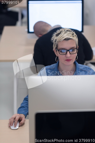 Image of startup business, woman  working on desktop computer