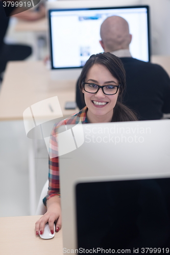 Image of startup business, woman  working on desktop computer