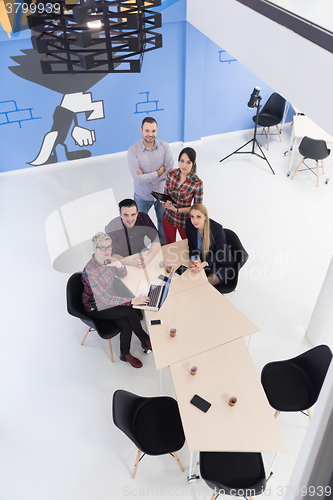 Image of aerial view of business people group on meeting