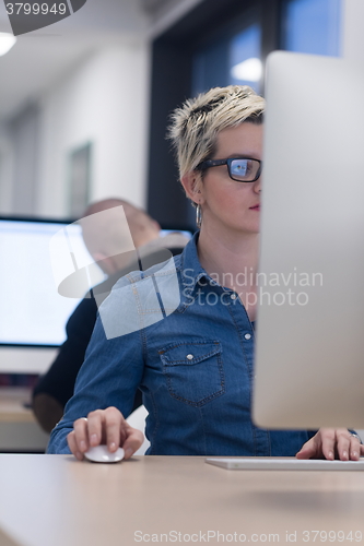 Image of startup business, woman  working on desktop computer