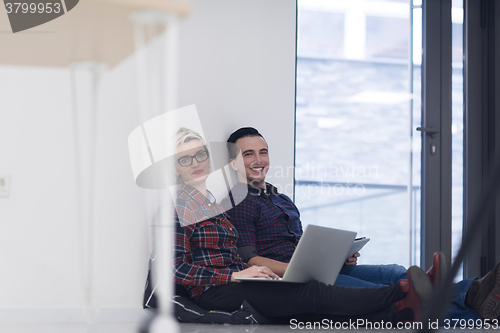 Image of startup business, couple working on laptop computer at office