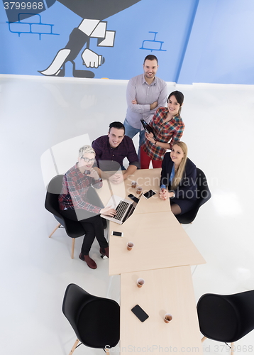 Image of aerial view of business people group on meeting