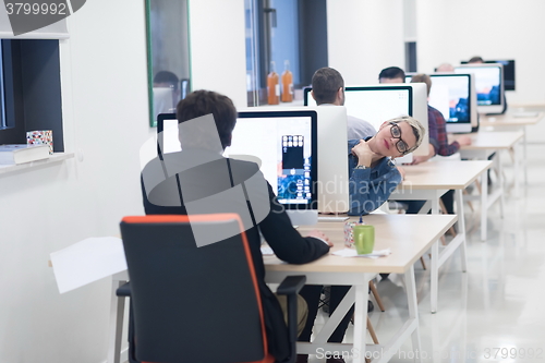 Image of startup business, woman  working on desktop computer