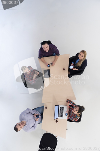 Image of aerial view of business people group on meeting