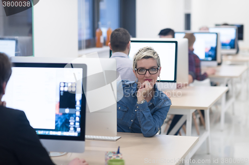 Image of startup business, woman  working on desktop computer