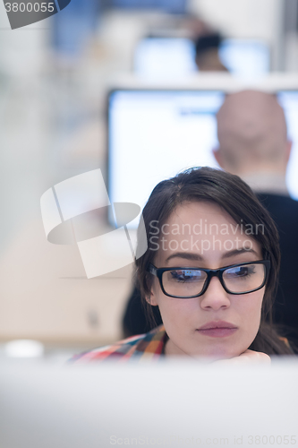 Image of startup business, woman  working on desktop computer