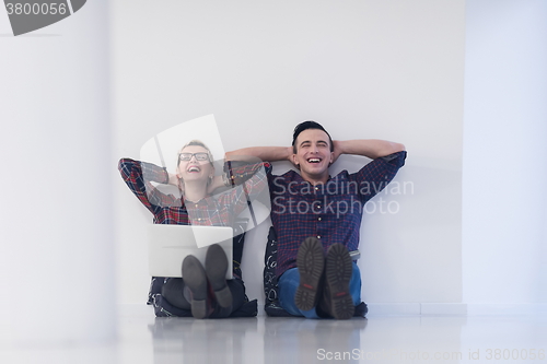 Image of startup business, couple working on laptop computer at office