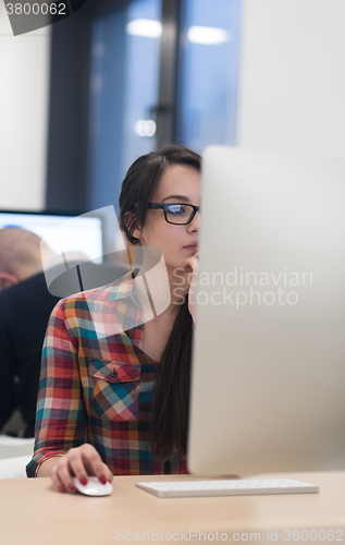 Image of startup business, woman  working on desktop computer