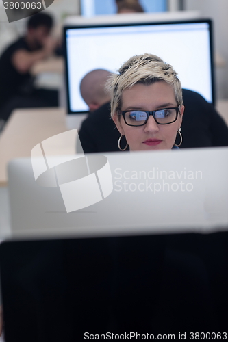 Image of startup business, woman  working on desktop computer