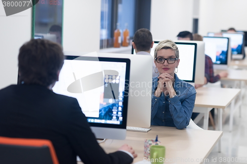 Image of startup business, woman  working on desktop computer