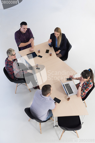 Image of aerial view of business people group on meeting