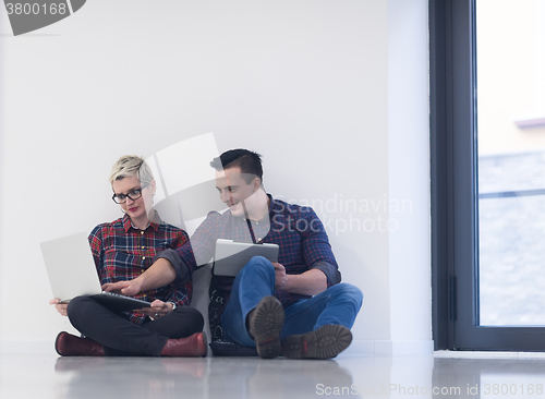 Image of startup business, couple working on laptop computer at office