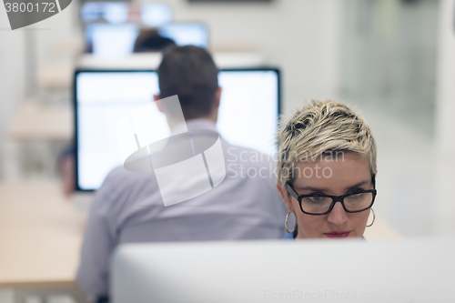 Image of startup business, woman  working on desktop computer