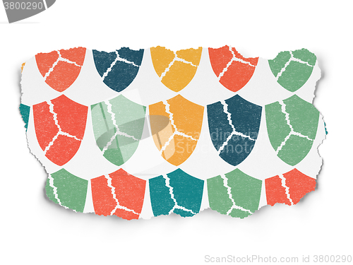 Image of Privacy concept: Broken Shield icons on Torn Paper background