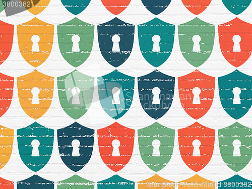 Image of Security concept: Shield With Keyhole icons on wall background