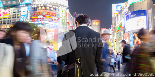 Image of Japanese businessman in Shibuya, Tokyo, Japan.