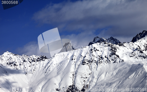 Image of Snowy avalanches mountainside at sunny day