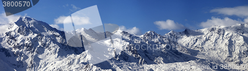 Image of Panoramic view on snowy mountains in sunny day