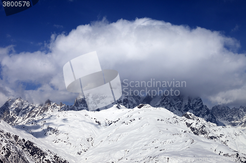 Image of Mount Ushba in clouds at winter