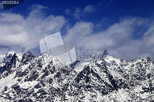Image of Snowy rocks at sunny day