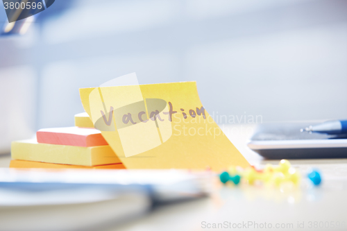 Image of Vacation text on adhesive note