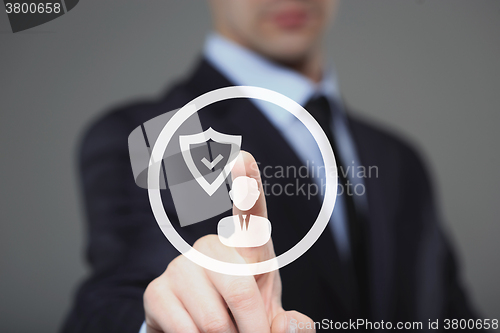 Image of business, technology, internet and networking concept - businessman pressing button with contact on virtual screens. 