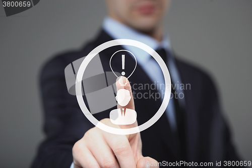Image of business, technology concept - businessman pressing button with bulb on virtual screens