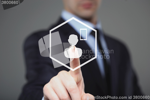 Image of businessman clicks  phone icon on the virtual screen