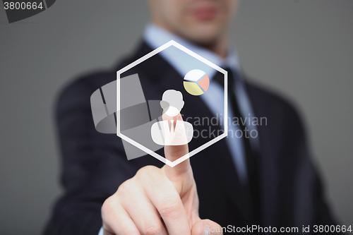 Image of Businessman Touching a Graph Indicating Growth